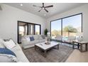 Bright living room with sliding doors opening to the backyard at 25838 N 104Th Pl, Scottsdale, AZ 85255