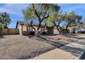 Single story home with a spacious front yard and mature trees at 2647 E Evergreen St, Mesa, AZ 85213