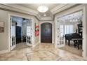 Elegant entryway with tile flooring and views into adjacent rooms at 280 N 159Th St, Gilbert, AZ 85234