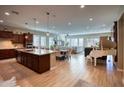 Open concept kitchen with granite island and modern appliances at 3331 E Coconino Dr, Gilbert, AZ 85298