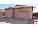 Two-car garage with double doors and a neutral color scheme at 3403 E Wyatt Way, Gilbert, AZ 85297