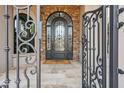 Elegant front entrance with an ornate iron door at 3611 E Kachina Dr, Phoenix, AZ 85044