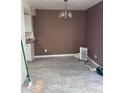 Empty dining room with grey tile floor at 4714 E Broadway Rd, Phoenix, AZ 85040