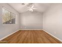 Bright bedroom featuring wood floors and a ceiling fan at 5315 W Christy Dr, Glendale, AZ 85304