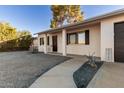 Landscaped front yard with a walkway leading to the home's entrance at 5315 W Christy Dr, Glendale, AZ 85304