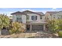 Charming two-story home with a brick paved driveway and neutral colored stucco at 55 N Abalone Ct, Gilbert, AZ 85233