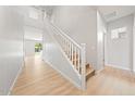 Modern staircase with white railings and light wood steps at 615 N Vine St, Chandler, AZ 85225