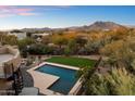 Stunning aerial view showcasing pool, landscape, and mountain views at 6708 E Calle De Las Estrellas Rd, Cave Creek, AZ 85331