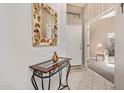 Bright entryway with tiled floor, console table, and mirror at 6730 E Hermosa Vista Dr # 75, Mesa, AZ 85215