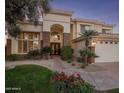 Elegant home with a welcoming entryway and mature landscaping at 7040 N 1St Ave, Phoenix, AZ 85021