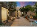 Peaceful courtyard with fountain and seating area; private oasis at 9926 E Hidden Green Dr, Scottsdale, AZ 85262