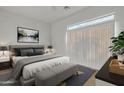 Spacious main bedroom with a large bed, plush bedding, and ample natural light at 1015 S Val Vista Dr # 87, Mesa, AZ 85204