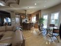 Open concept kitchen with breakfast bar and hardwood floors at 10360 N 110Th Pl, Scottsdale, AZ 85259