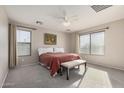 Bright bedroom with a large bed and neutral color scheme at 12815 W Milton Dr, Peoria, AZ 85383