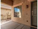 Covered porch with keypad entry and exterior lighting at 12815 W Milton Dr, Peoria, AZ 85383