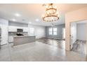 Open concept kitchen with an island and stainless steel appliances at 12958 E Larrea Ln, Florence, AZ 85132