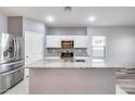 Modern kitchen with stainless steel appliances and granite countertops at 12958 E Larrea Ln, Florence, AZ 85132