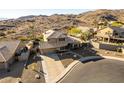 Two-story house with pool and landscaped backyard in a mountain setting at 14422 S 24Th Pl, Phoenix, AZ 85048