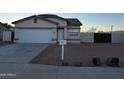 Newly constructed single story home with attached garage at 16008 N Hollyhock St, Surprise, AZ 85378