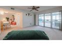 Spacious living room with sliding glass doors leading to patio at 17318 N Del Webb Blvd, Sun City, AZ 85373