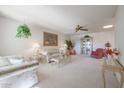 Bright living room featuring comfy seating and a decorative cabinet at 17318 N Del Webb Blvd, Sun City, AZ 85373