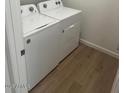 Bright laundry room with washer and dryer included at 17814 W Carol Ave, Waddell, AZ 85355