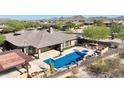 Stunning aerial view of home with pool and landscaped yard at 18007 W Ocotillo Ave, Goodyear, AZ 85338