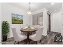 Cozy dining area with a wood table and chairs, complemented by stylish decor at 22125 N 29Th Ave # 127, Phoenix, AZ 85027