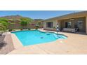 Inviting backyard pool with a patio and seating area at 28957 N 70Th Dr, Peoria, AZ 85383