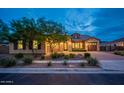 Brick home with a welcoming front yard, two car garage and beautiful landscaping at 2915 E Constance Way, Phoenix, AZ 85042