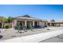 One story house with a two car garage and desert landscaping at 3127 W Folgers Rd, Phoenix, AZ 85027