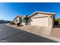 View of the home's exterior, including the garage at 3301 S Goldfield Rd # 4086, Apache Junction, AZ 85119