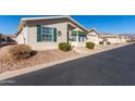 Single story home with a carport and desert landscaping at 3301 S Goldfield Rd # 4086, Apache Junction, AZ 85119