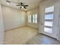 Light and airy living room with tile flooring and neutral walls at 3448 E Spring Wheat Ln, Gilbert, AZ 85296