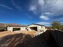 The home features large garages and plenty of potential at 4215 S Willow Springs Trl, Gold Canyon, AZ 85118