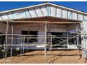 Rear exterior of under construction home; scaffolding and insulation visible at 4215 S Willow Springs Trl, Gold Canyon, AZ 85118