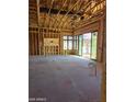 Under construction living room; framing, large windows and fireplace at 4215 S Willow Springs Trl, Gold Canyon, AZ 85118