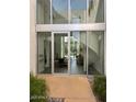 Modern entryway with glass doors offering a view into the living area at 4666 N 40Th St, Phoenix, AZ 85018