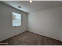 Bright bedroom with neutral walls and carpeted floors at 47762 W Moeller Rd, Maricopa, AZ 85139