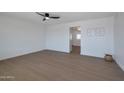 Spacious bedroom with hardwood floors and ceiling fan at 5490 E Boise St, Mesa, AZ 85205