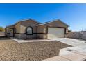 Newly built home with a neutral color scheme and a two-car garage at 603 S 7Th St, Avondale, AZ 85323