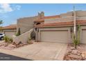 Two-car garage and inviting entryway of this beautiful home at 6168 S Fairway Pl, Gold Canyon, AZ 85118