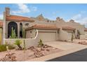 Spanish-style home with a two-car garage and drought-tolerant landscaping at 6168 S Fairway Pl, Gold Canyon, AZ 85118