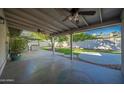 Covered patio with ceiling fans, offering shade and outdoor living space at 6630 E Dreyfus Ave, Scottsdale, AZ 85254