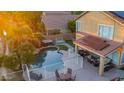 Inviting pool and spa area with patio furniture and lush landscaping at 6811 W Monona Dr, Glendale, AZ 85308