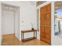 Entryway with wood floors and a console table at 7297 E Black Rock Rd, Scottsdale, AZ 85255