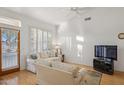 Living room with view of patio, hardwood floors and sofas at 7297 E Black Rock Rd, Scottsdale, AZ 85255