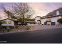 House exterior with a long driveway and landscaping at 7348 N Red Ledge Dr, Paradise Valley, AZ 85253