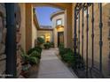 Elegant entryway with wrought iron gate and courtyard at 8531 E Twisted Leaf Dr, Gold Canyon, AZ 85118