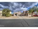 One-story home with a two-car garage and street view at 9909 W Miami St, Tolleson, AZ 85353